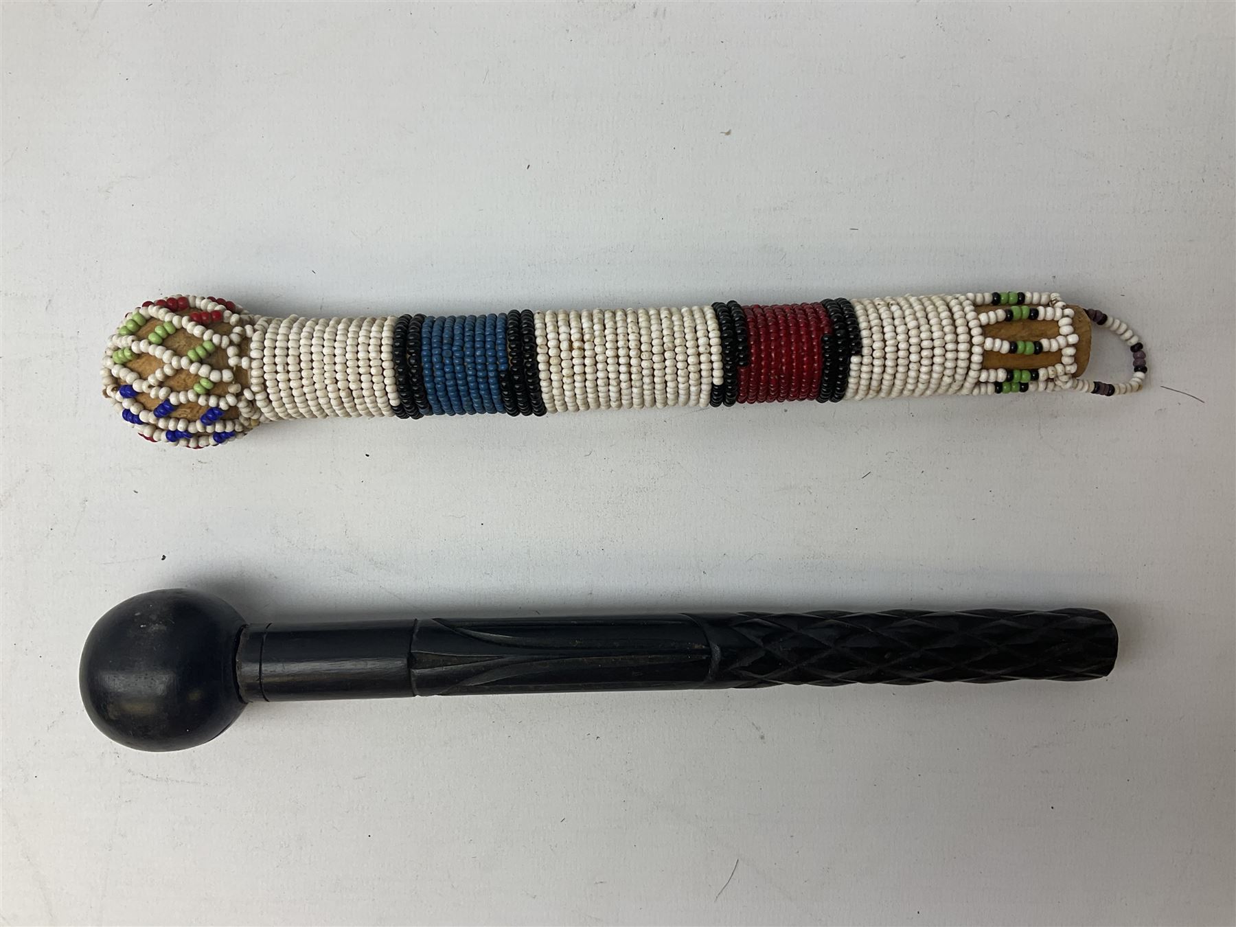 Miscellaneous items including two native ceremonial maces; steel spear head; pair of chrome plated spurs by Geo. Parker & Sons; WW1 French & Son marching compass leather case; scissor action bullet mould etc