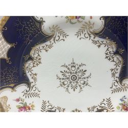 Coalport cobalt blue batwing pattern tea wares, decorated with finely enamelled floral sprays within gilt reserves, comprising teacup trio, coffee can and saucer and other cup and saucer, twin handled cake plate, milk jug and open sucrier, and circular plate retailed by T. Goode & Co London, pattern no Y2665,  all with green Coalport AD 1750 marks beneath, largest W26cm (11)