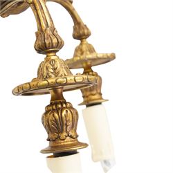 Pair of Lous XVI style ormolu three branch wall sconces, with scrolling foliate backplates and leaf-capped reeded scrolling branches, converted to electricity 