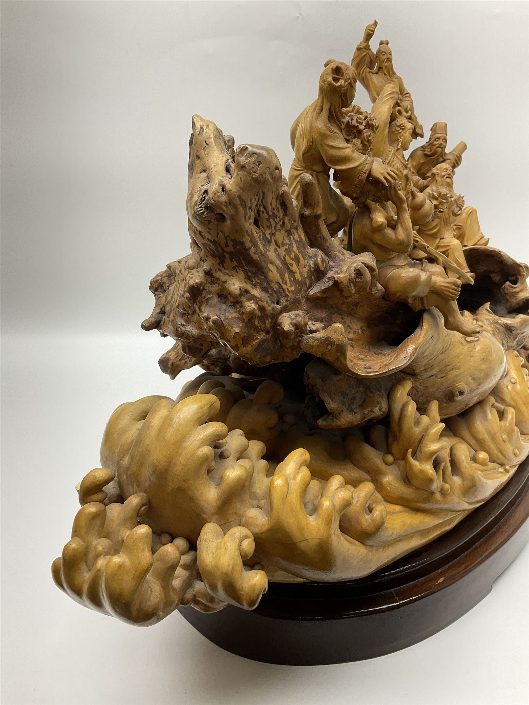 Large Chinese wood carving, depicting the eight immortals crossing the sea, H46cm, L78cm 