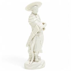 Pair of 19th century Berlin blanc de chine figures of flower sellers on circular bases, H25cm and similar of an oriental archer, together with a figural group of mother and child (4)