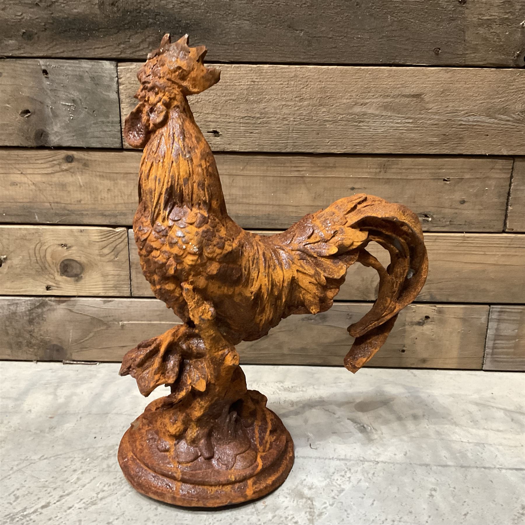 Small cast iron cockerell, on circular base