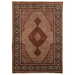 Persian Bidjar peach ground rug, the field decorated with repeating Herati motifs, darker ground outlined pole medallion, the field border decorated with repeating plant motifs, multiple floral design guard bands