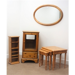  Ducal pine nest of three tables (W53cm, H48cm, D44cm) an oval mirror, CD tower and side cabinet with glass door and single drawer (4)Ducal pine corner cabinet, single arched glazed door with illuminated interior, above cupboard door, on shaped bracket supports, W71cm, H188cm, D44cm  