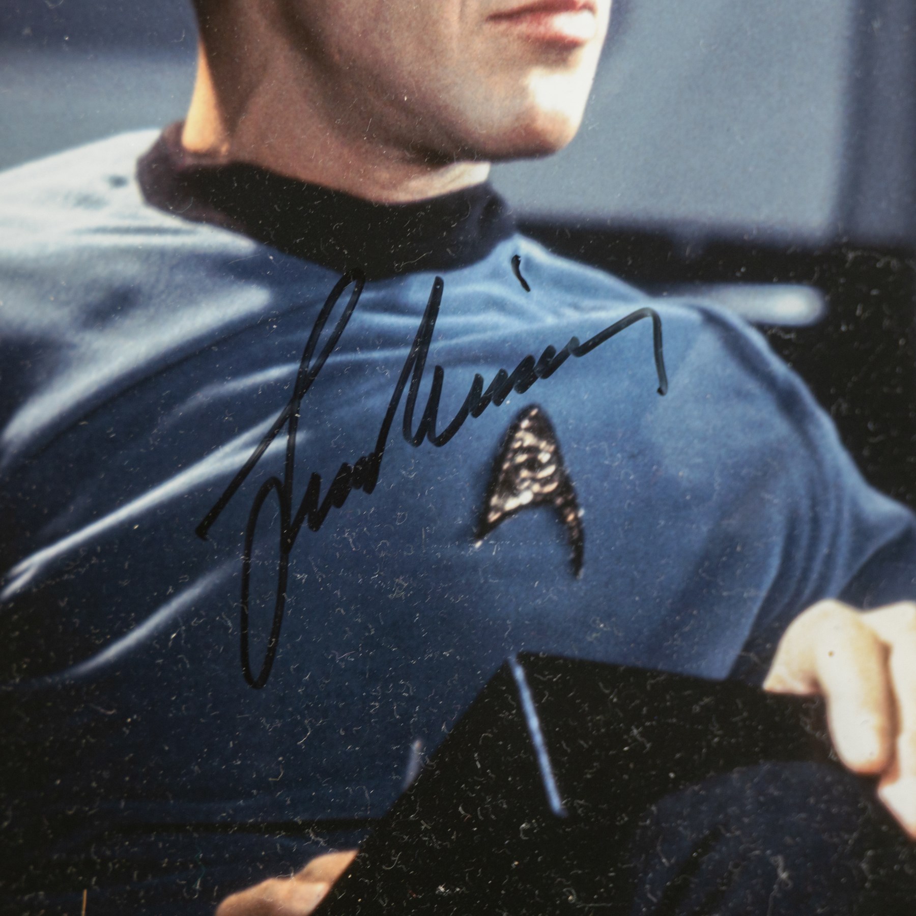 Limited edition Star Wars print 'The Voyage Begins' by Stewart Robinson numbered 516/1701, framed above three signed photographs of William Shatner as Captain James T. Kirk, Leonard Nimoy as Mr Spock and The Star Trek Legendary Four, all with certificates of authenticity verso, frame H109cm, W90cm