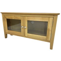 Light oak corner television stand, fitted with two glazed cupboard doors