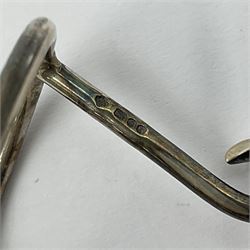 Modern silver limited edition Easter egg, no. 70/500, the gilt openwork body decorated with cascading bluebells and hinged cover with pierced circular panel set with a single faceted purple stone, opening to reveal a gilt interior, upon silver stand with three scrolling pad feet, each hallmarked St James House Company, London 1981, height including stand 8cm