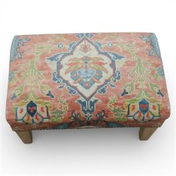 Pair of needlepoint footstools, retailed by The Bespoke Footstool Co, brass studded trim on tapered oak supports