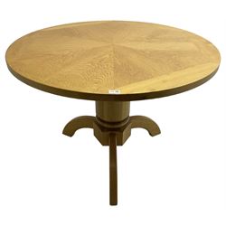 Solid oak dining table, circular top over cylindrical pedestal terminating in three shaped supports