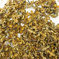 Large quantity of Victorian brass upholstery pins with rosette and fleur de lis designs 
Provenance: property of a Nobleman