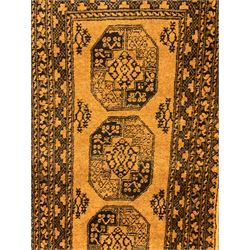 Afghan Bokhara gold ground runner, decorated with seven Gul medallions, six band border with repeating geometric pattern