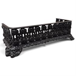 Three cast iron fireplace fittings, comprising a Regency-style fire grate with sunburst crest, urn finials, bowed basket and scroll supports (W58cm H63cm); Victorian fender with pierced acanthus frieze and foliate base (W64cm H20cm); Gothic Revival fireplace with fleur-de-lis crest, arched surround and integral fire basket (W41cm H87cm)