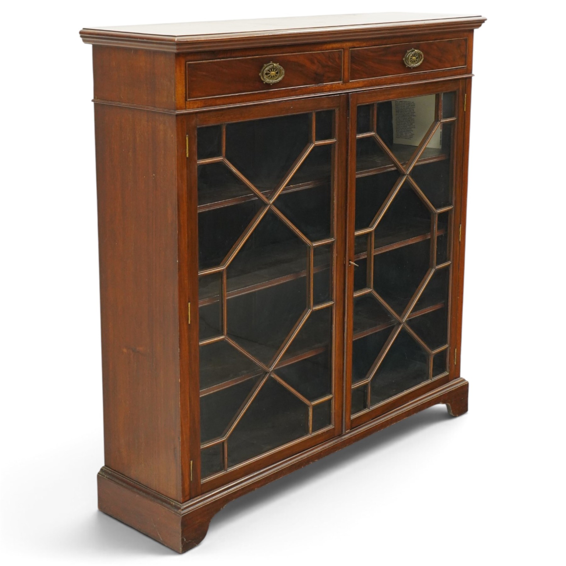 Late 19th century mahogany bookcase, fitted with two drawers over twin astragal glazed doors, enclosing three adjustable shelves, on bracket feet