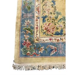 Large Chinese washed woollen carpet, pale sage green ground and decorated with flowers