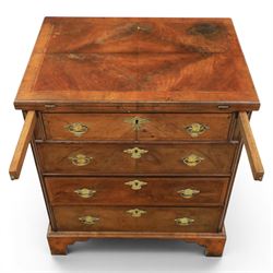 Early 20th century Georgian design figured walnut bachelor's chest, with half fold over top and lopers, over three drawers with pierced brass handles and escutcheons 