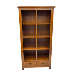 Hardwood open bookcase, fitted with eight open shelves above two drawers, panelled sides on square tapering feet