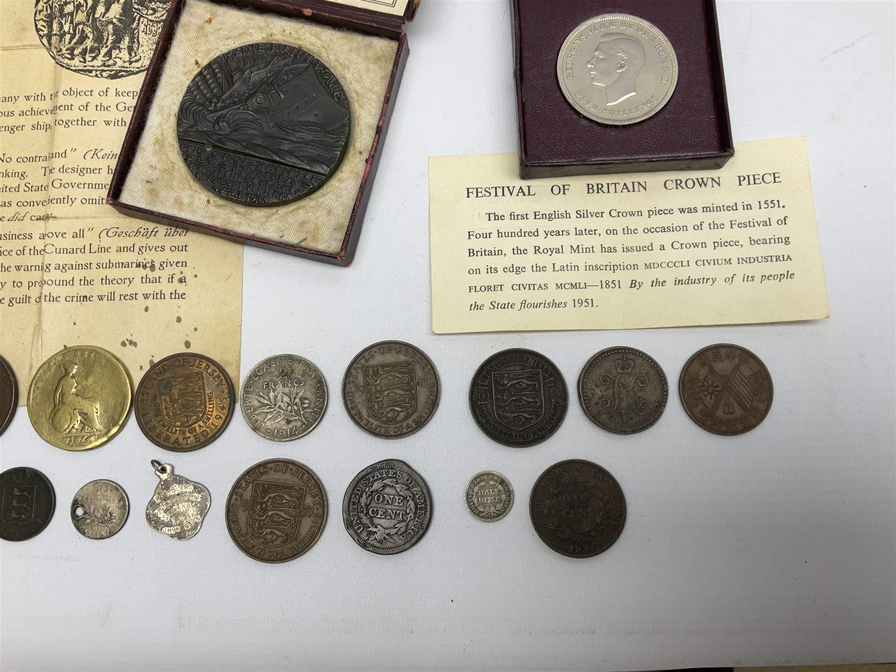 Lusitania replica medal, boxed and various coins including King George VI 1951 Festival of Britain crown, United States of America 1844 one cent and 1850 half dime, Queen Victoria States of Jersey 1844 one thirteenth of a shilling, etc