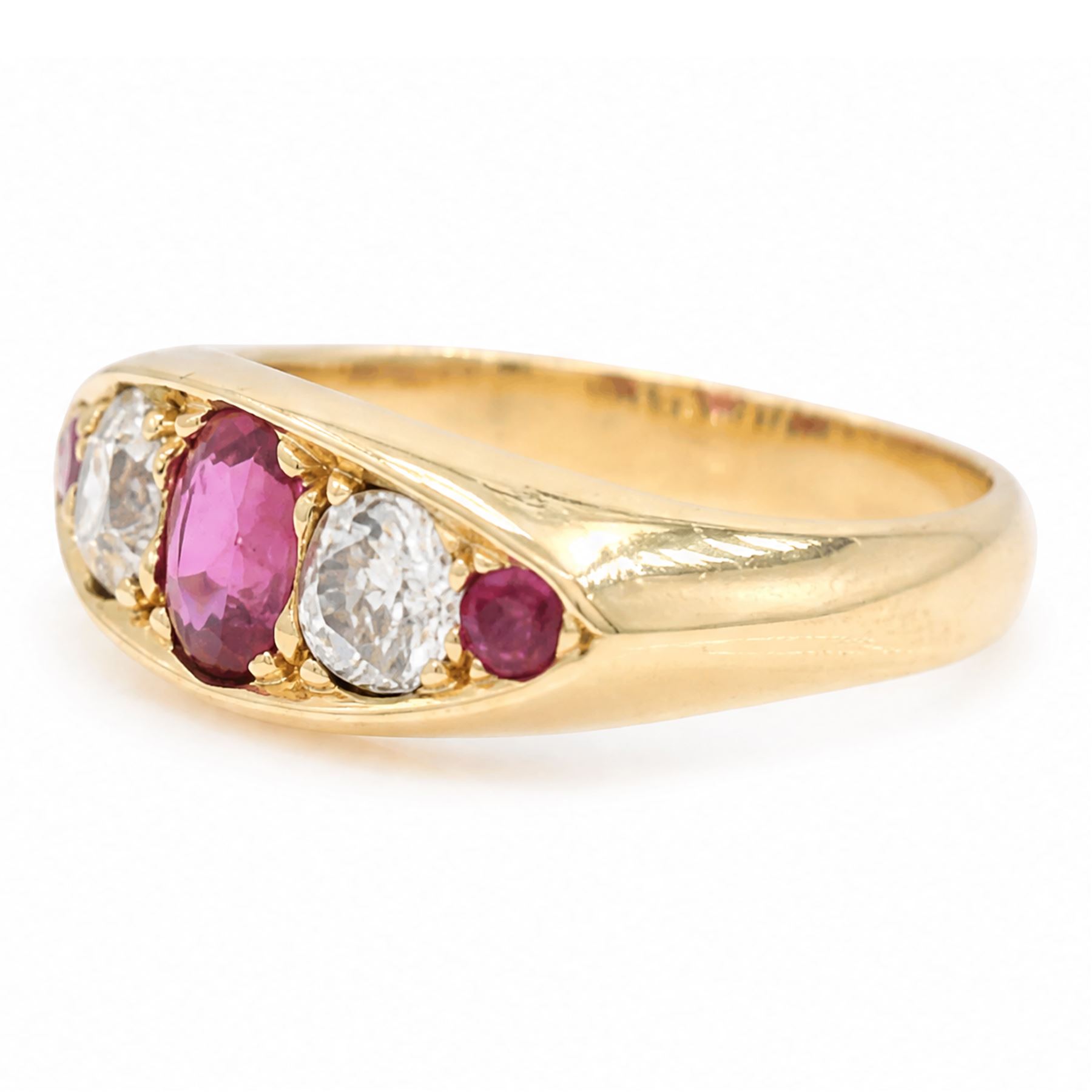Early 20th century gold ruby and diamond five stone marquise set ring, principal oval cut ruby of approx 0.60 carat, flanked by two old cut diamonds and two round cut rubies, stamped 18ct, total diamond weight approx 0.80 carat