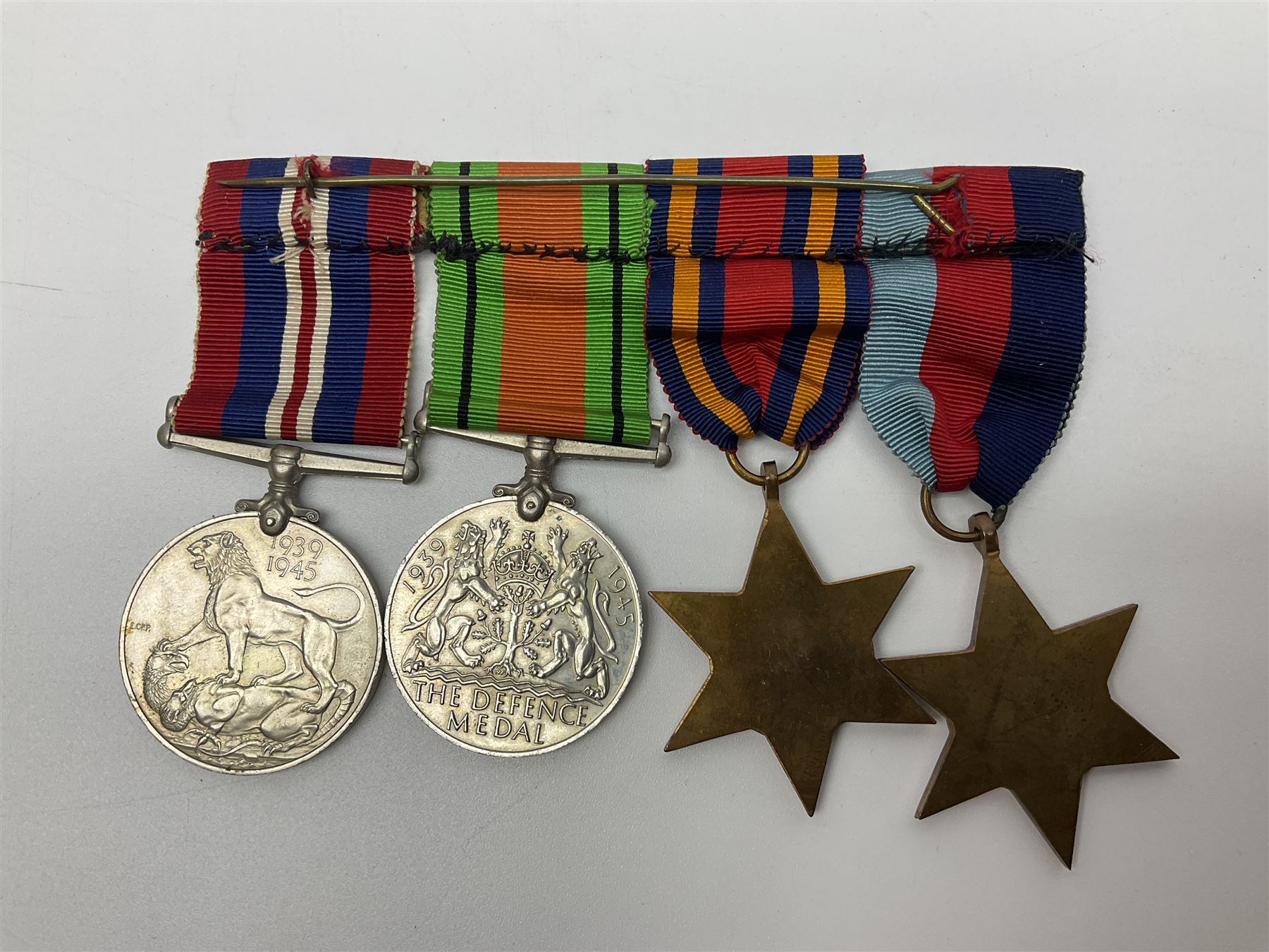 Collection of WW2 and police medals c.1933-1955, awarded to Eric Drinkwater comprising 1939-45 War Medal, Defence Medal, 1939-45 Star and Burma Star, on wearing bar; 1918-62 General Service Medal with Cyprus clasp to P.S. E.G. Drinkwater; boxed; Police Long Service and Good Conduct Medal to Const. Eric C. Drinkwater; cased; Royal Life Saving Society bronze medal to E.C. Drinkwater July 1933; boxed; and George V 1937 coronation medallion; boxed.