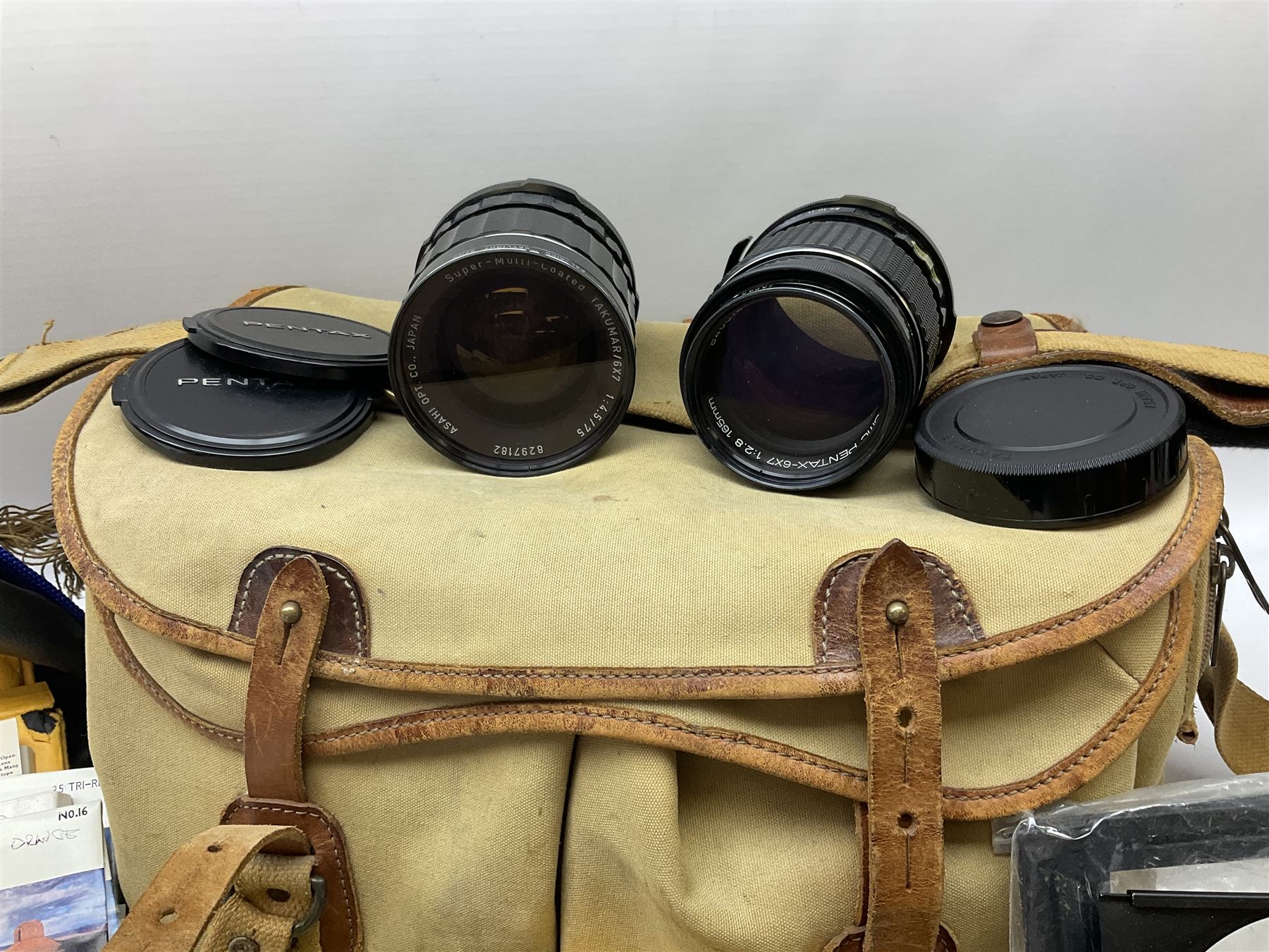 Pentax 67II camera with Asahi SMC Pentax - 6x7 ‘1:4 45mm’ lens, Asahi Takumar / 6x7 ‘1:4.5/75’ lens, Asahi Macro-Takumar / 6x7 ‘1:4/135’ lens, Asahi SMC Pentax - 6x7 ‘1:2.8 165mm’ lens, Asahi Pentax 6x7 rear converter ‘T6-2X’, lens filters and various other accessories, housed in a Billingham carry bag