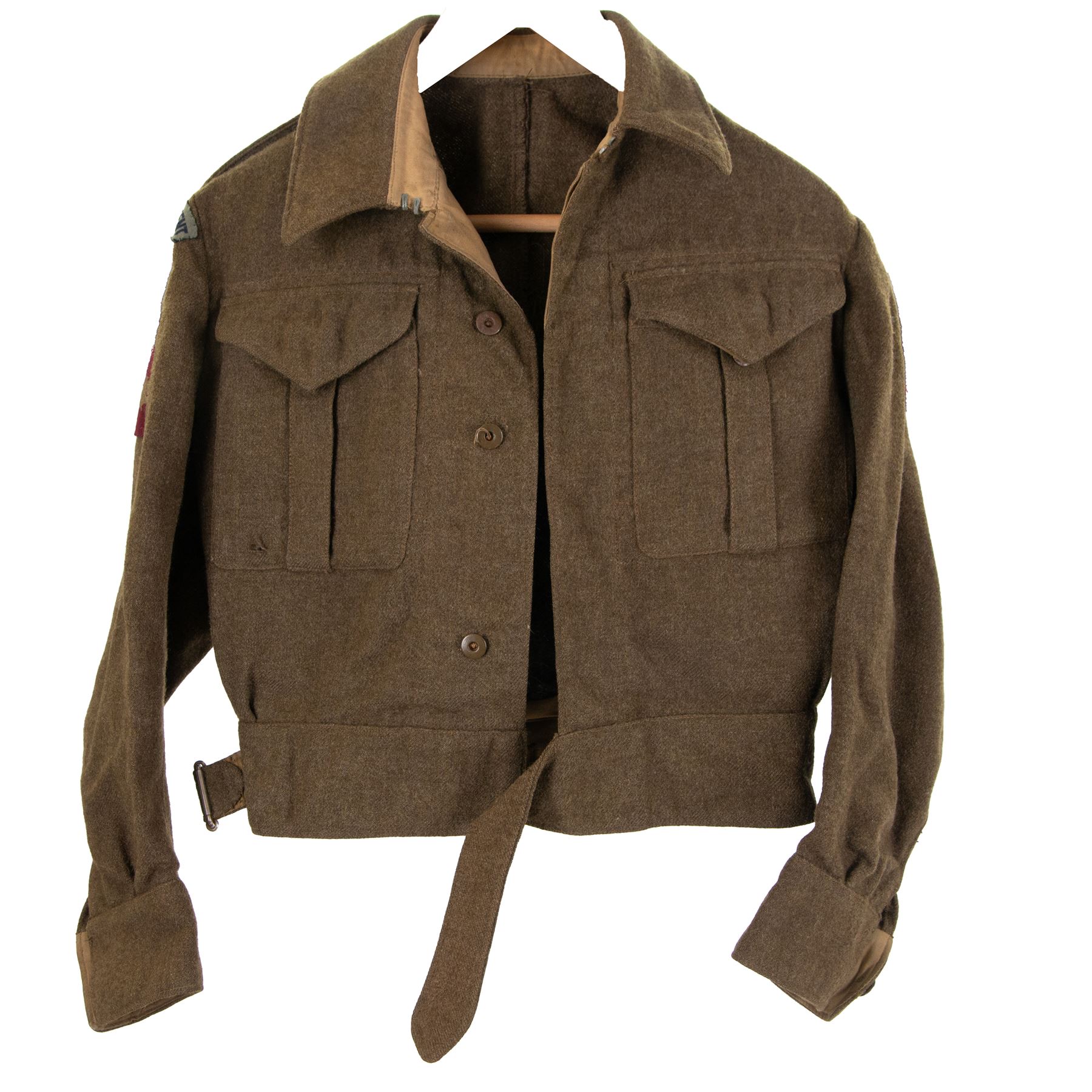 WWII British parachute regiment battle dress uniform, the jacket with shoulder title and Pegasus formation badge to the left arm, shoulder title, Pegasus formation badge and cloth wings to the right, size 3 dated 1943, the trousers size 3 dated 1945 