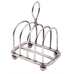 Victorian silver five bar toast rack, with curved bars and central ring handle, upon four ball feet, hallmarks Henry Wilkinson & Co, London 1895, H11cm, approximate weight 3.80 ozt (118.2 grams)
