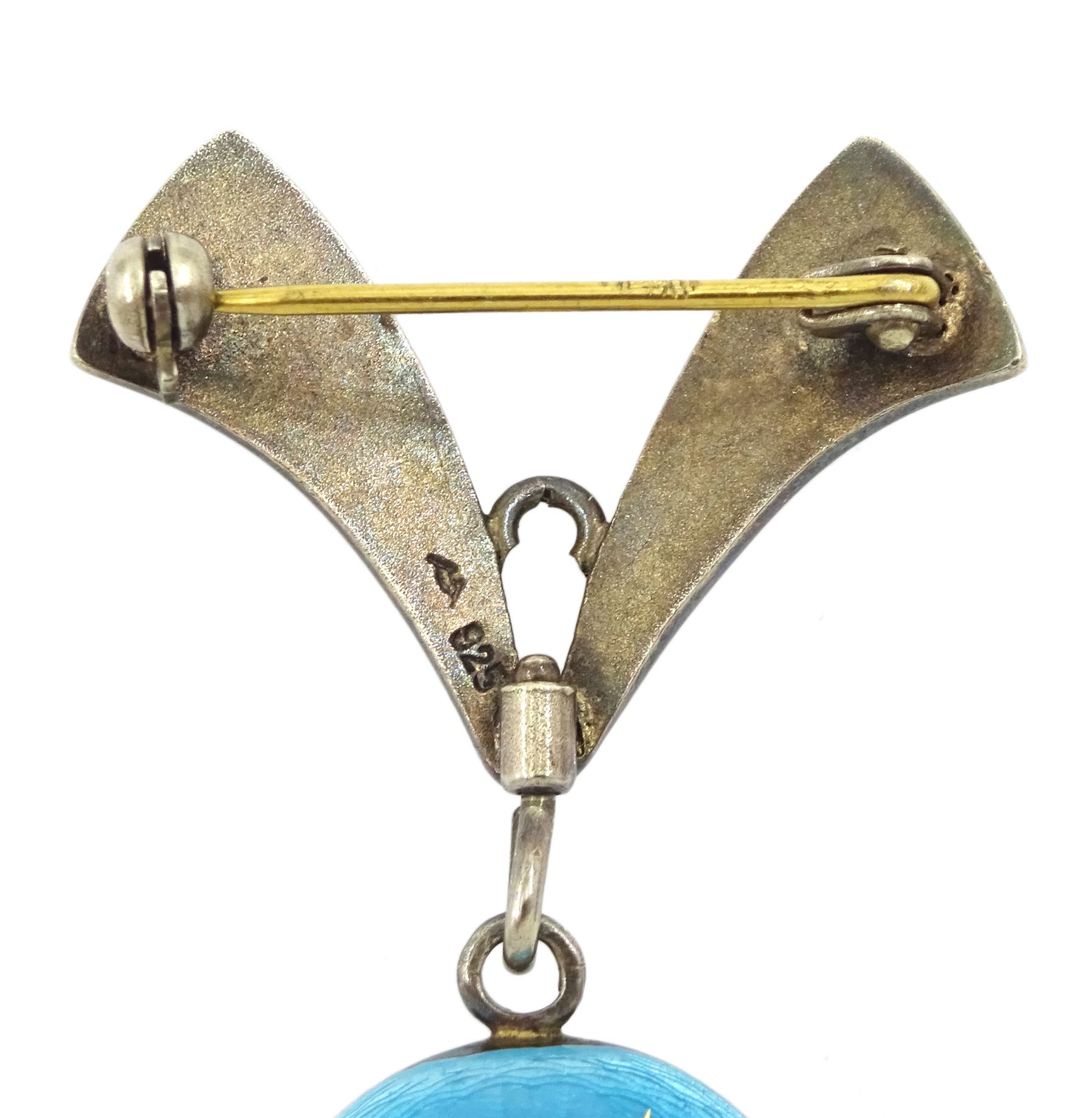 Nadine Swiss silver and enamel fob watch, silvered circular dial with baton markers, cased in blue guilloche enamel with gilt decoration, suspended from a matching brooch