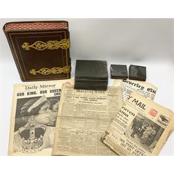 Victorian photo album with decorative metal clasps and embossed decoration, containing photographs, along with a selection of glass negative slides and lantern slides 