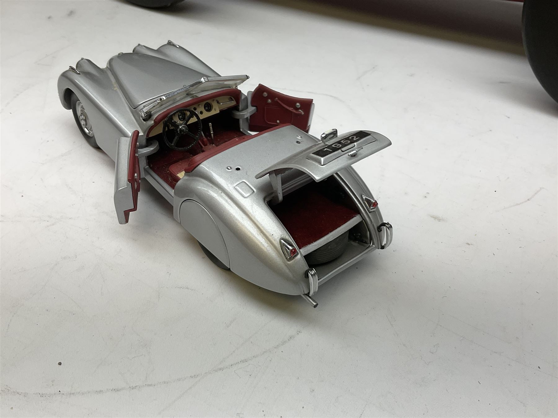 Four Franklin Mint Precision Models, one with hardwood body; large reproduction model of a vintage racing car L52cm; and four other modern metal/wooden models of vintage cars; all unboxed (9)