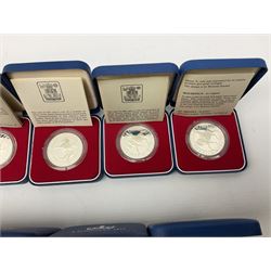 Eighteen Queen Elizabeth II 1977 silver proof crown coins, all cased with certificates (18)