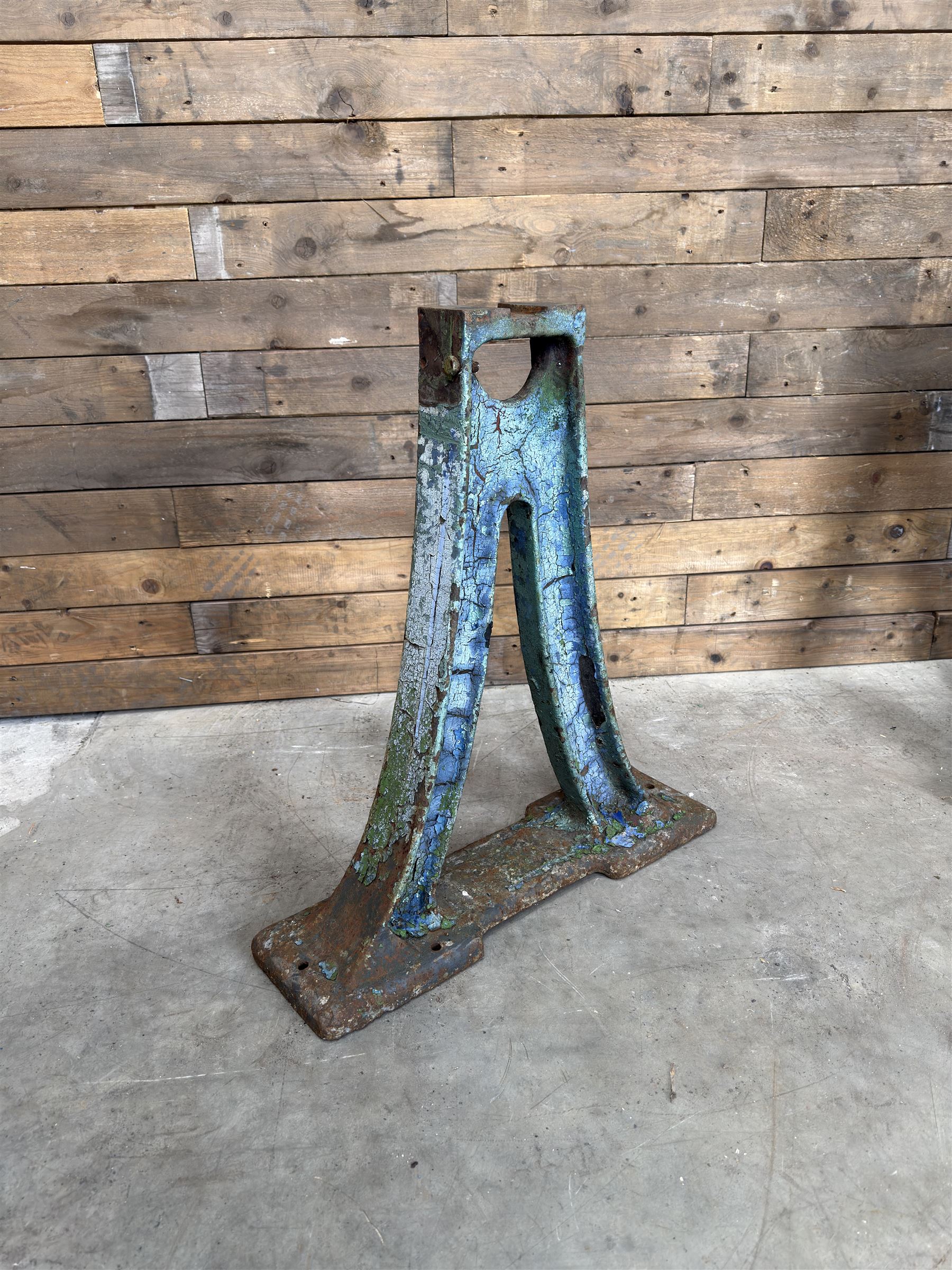 Pair of late 19th century heavy cast iron garden industrial trestles, painted in distressed blue paint