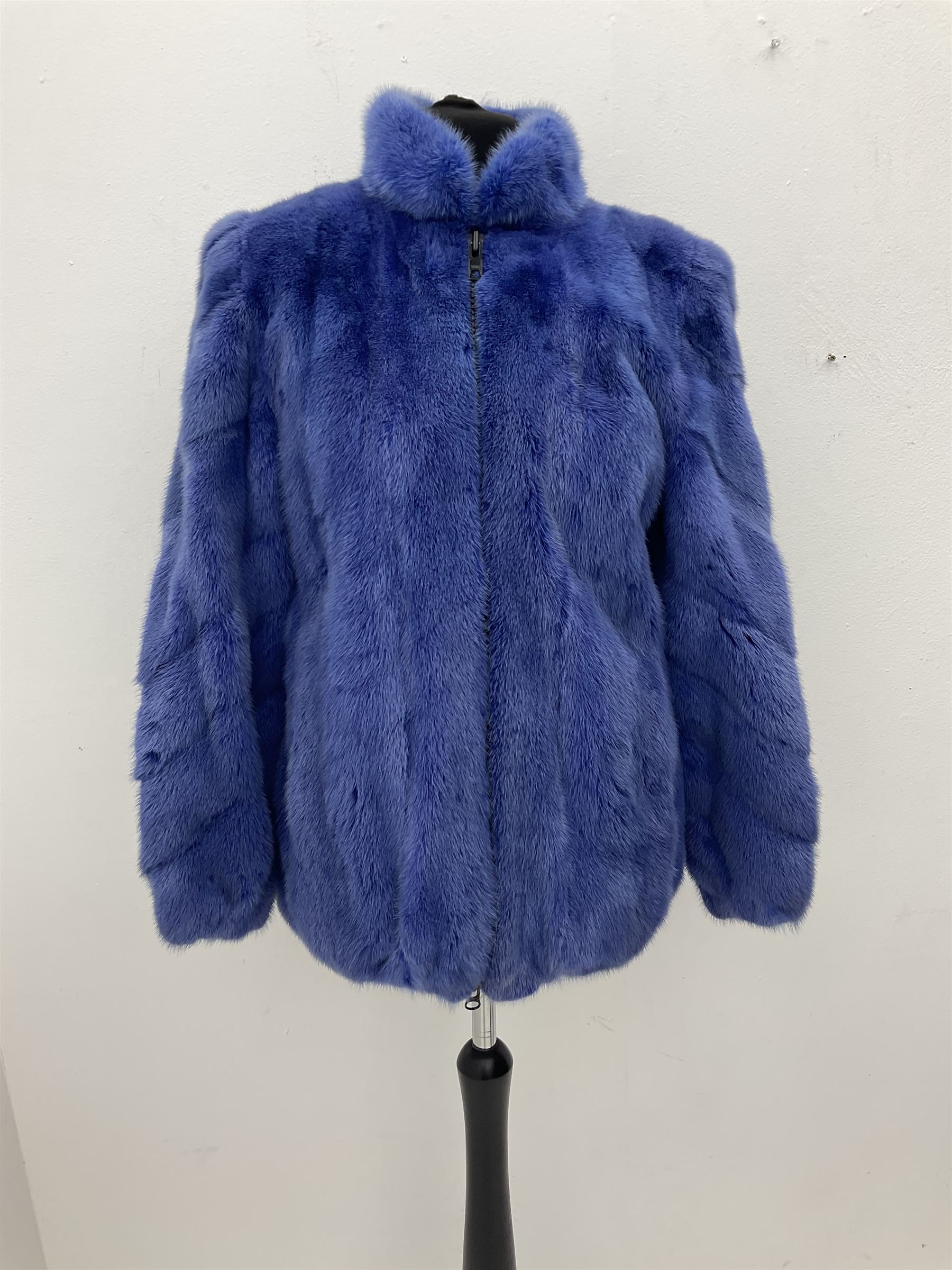 Modern cut lightweight skins lavender blue mink jacket, approx size 10 to 14, with elasticated cuffs, stand up small collar, black satin style lining, zip fastener, perfect condition as new, top class mink.
