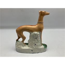Staffordshire style figure of a greyhound beside a dead rabbit, H25cm