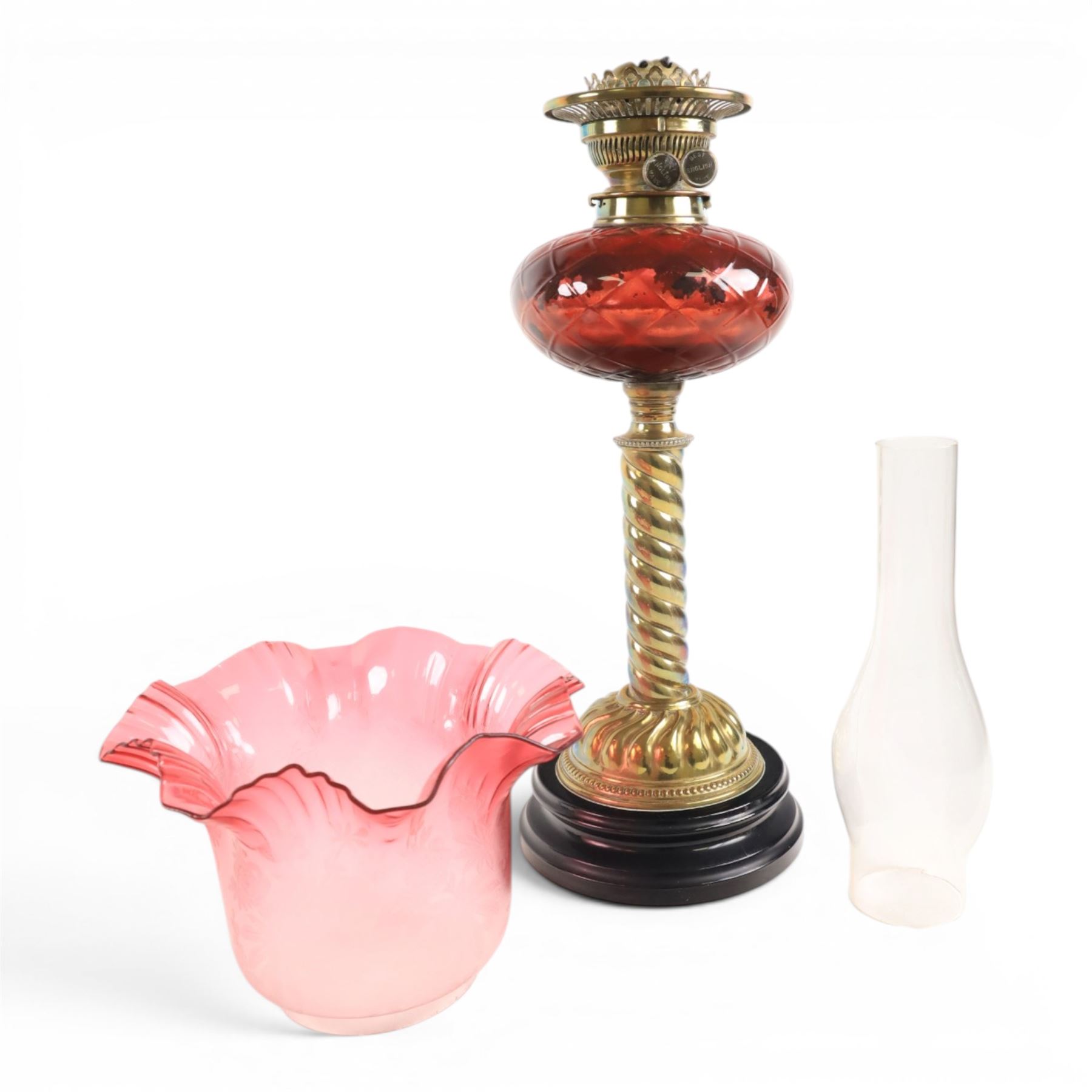Victorian oil lamp, with etched shade with fluted rim, above a cranberry reservoir, on twisted brass pedestal and decorative base, together with cranberry glass jar, lamp H72cm 