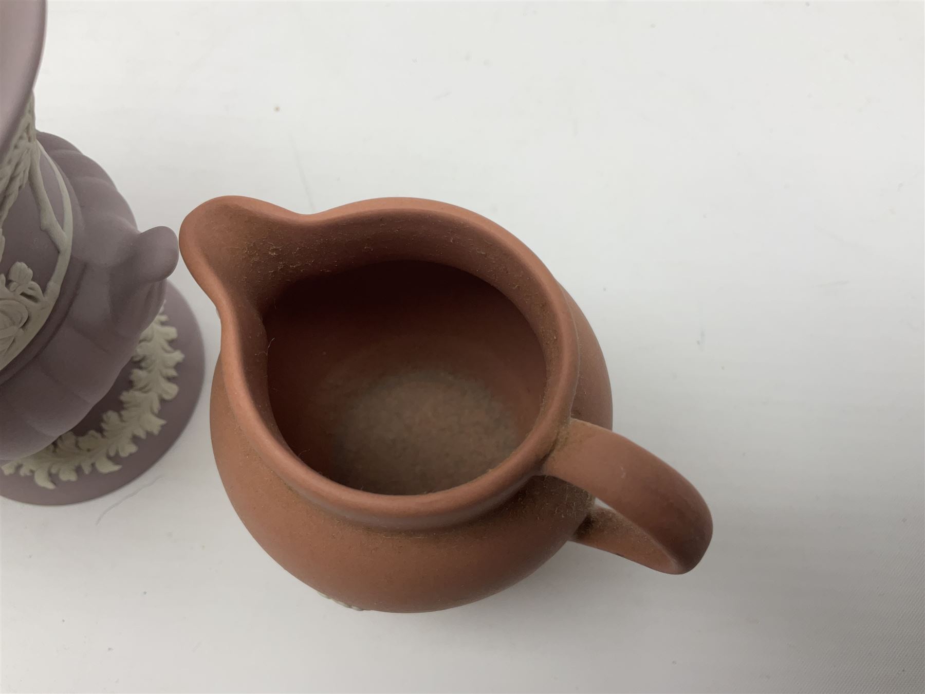 Collection of Wedgwood Jasperware, in orange, lilac and pink colourways, including oval tray, small jug, trinket boxes, trinket dishes, etc , all with impressed mark beneath