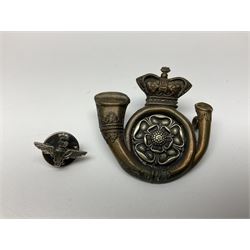Parachute regiment - chrome crest on oak easel shield; three cloth badges; small silver plated figure; and pin badge; together with 10cm diameter cannon ball etc