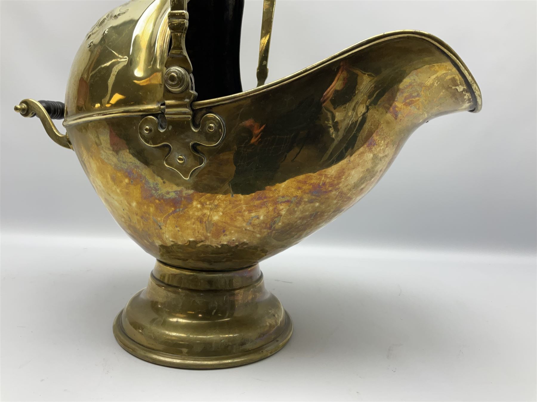 Victorian brass coal scuttle, of helmet form with turned ebonised handles, H48cm