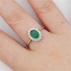 18ct white gold oval cut emerald and round brilliant cut diamond cluster ring, emerald approx 0.85 carat, total diamond weight approx 0.30 carat