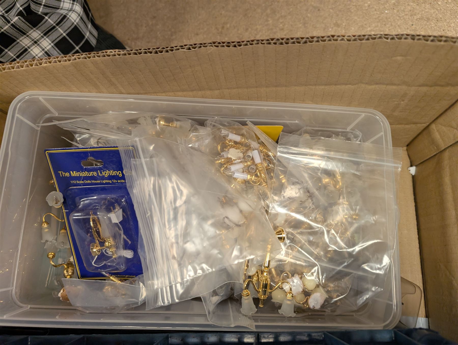 Dolls House building accessories, including three stair cases, a quantity of doors and windows, skirting board, coving, kitchen and fireplaces scenes and a collection of wired and non wired light fittings