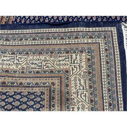 Large North-West Persian Arrak indigo ground carpet, the field decorated all-over with small Boteh motifs, multiple band border decorated with repeating geometric designs 