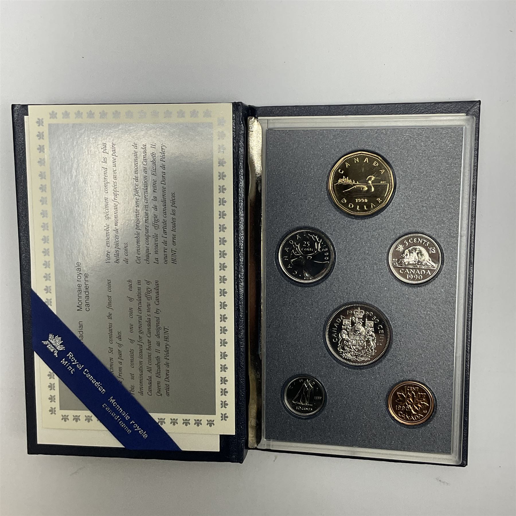 Mostly Canadian coins including 1967 six coin set, various Canadian 50 cent coins, various nickels, Royal Canadian Mint 1990 specimen coin set in blue folder with outer sleeve, various Canadian dollars etc, in folders and loose