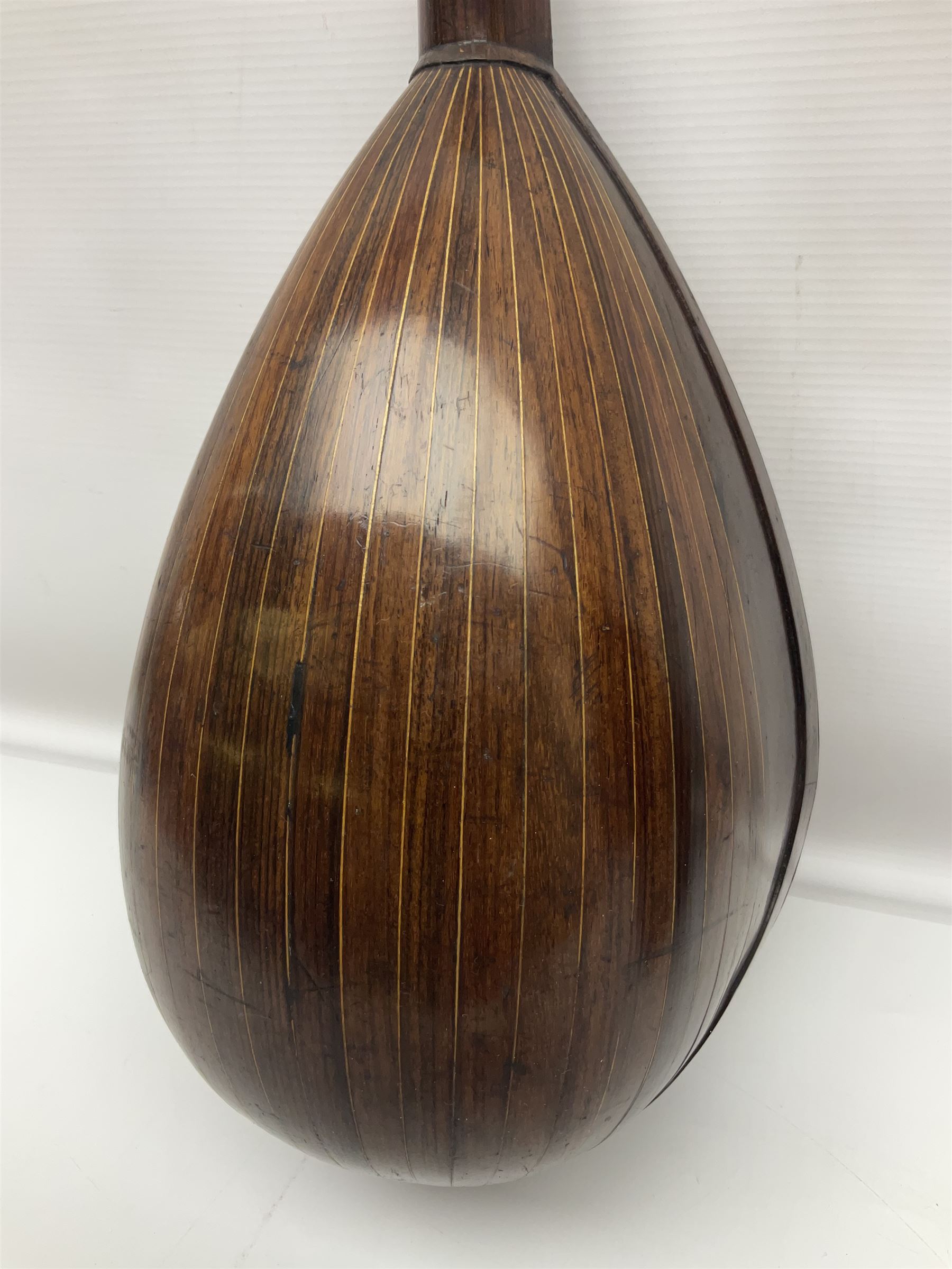 Late 19th century Italian lute back mandolin with segmented bowl back, bears label Gennaro Maglioni Napoli L61cm; in ebonised wooden case; together with another similar damaged Italian lute back mandolin for restoration or spares (2)