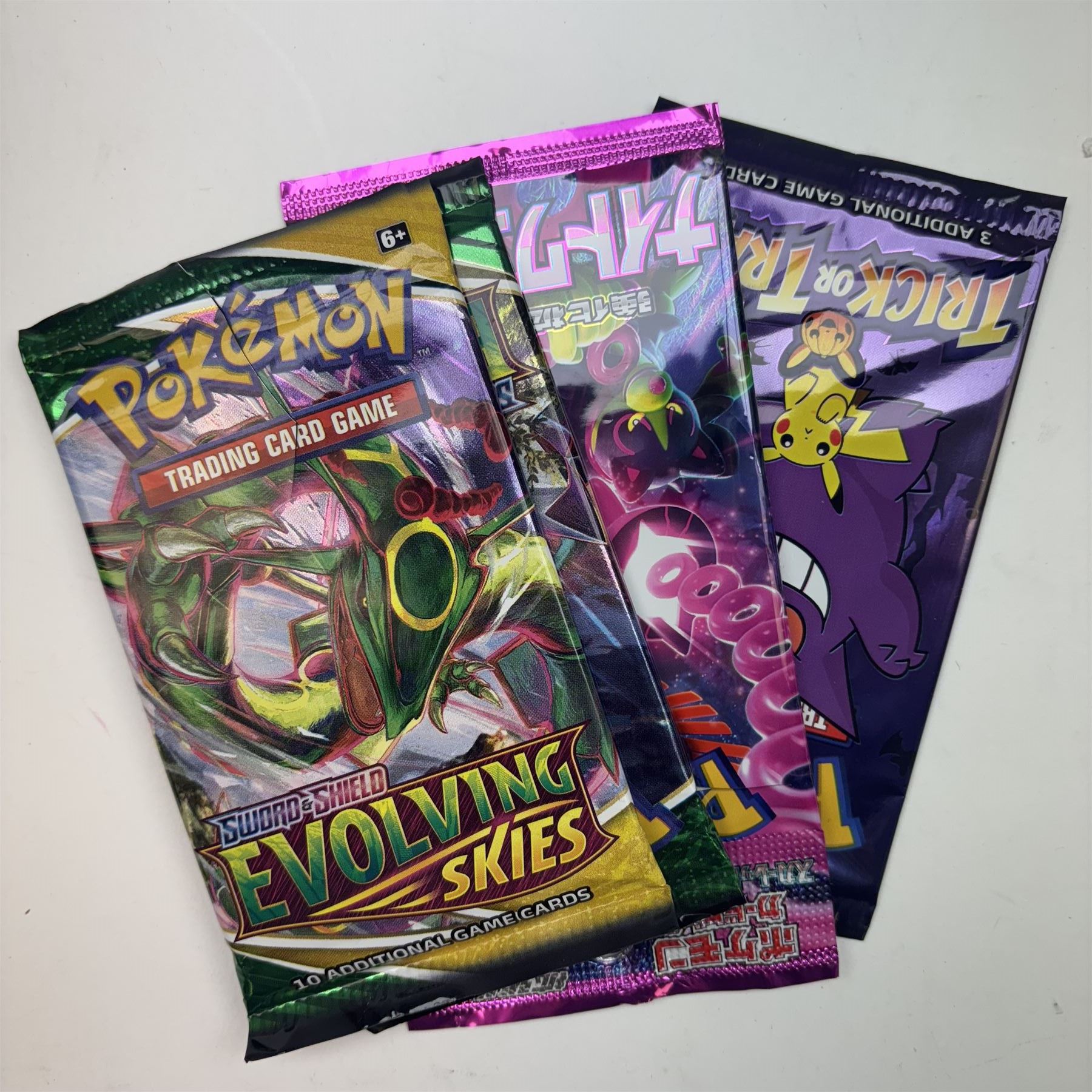 Collection of modern Pokemon TCG trading cards from the Scarlet & Violet and Sword & Shield eras, contained within in two folders, opened packets and loose, together with a graded Sword & Shield Silver Tempest Passiman TG08, GET Graded 9 Mint, two oversized cards, energy cards, vintage booklets and boxes, empty tins, 1998 Electronic Pokédex and other accessories