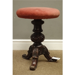  Victorian walnut revolving piano stool, turned column with three carved supports, H47cm   