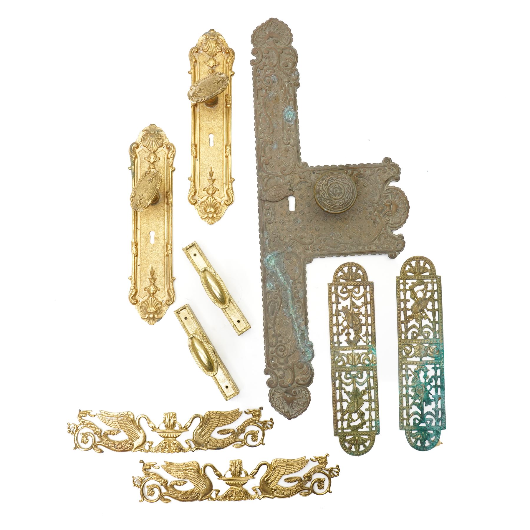 Large Victorian embossed brass door plate by Turner & Fowle with circular handle L63cm , pair of period design gilt brass door plates with oval handles, two more pairs of brass door plates and pair of brass door handles  
Provenance: property of a Nobleman