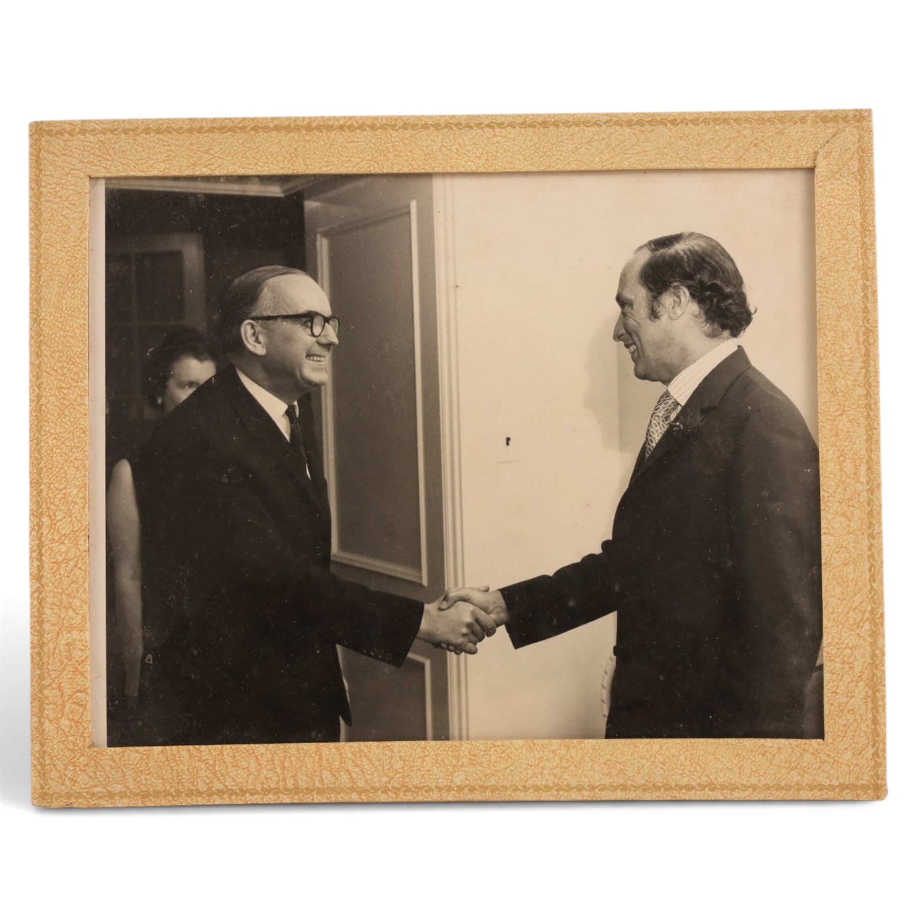 HRH The Duke of Edinburgh signed black and white presentation portrait photograph of Prince Philip wearing Naval uniform, signed in ink on mount ‘Philip 1959’, 20cm x 15cm, contained within a rectangular silver frame, together with a framed photograph of the Prince in India 1959 greeting guests at a formal event and a further black and white photograph