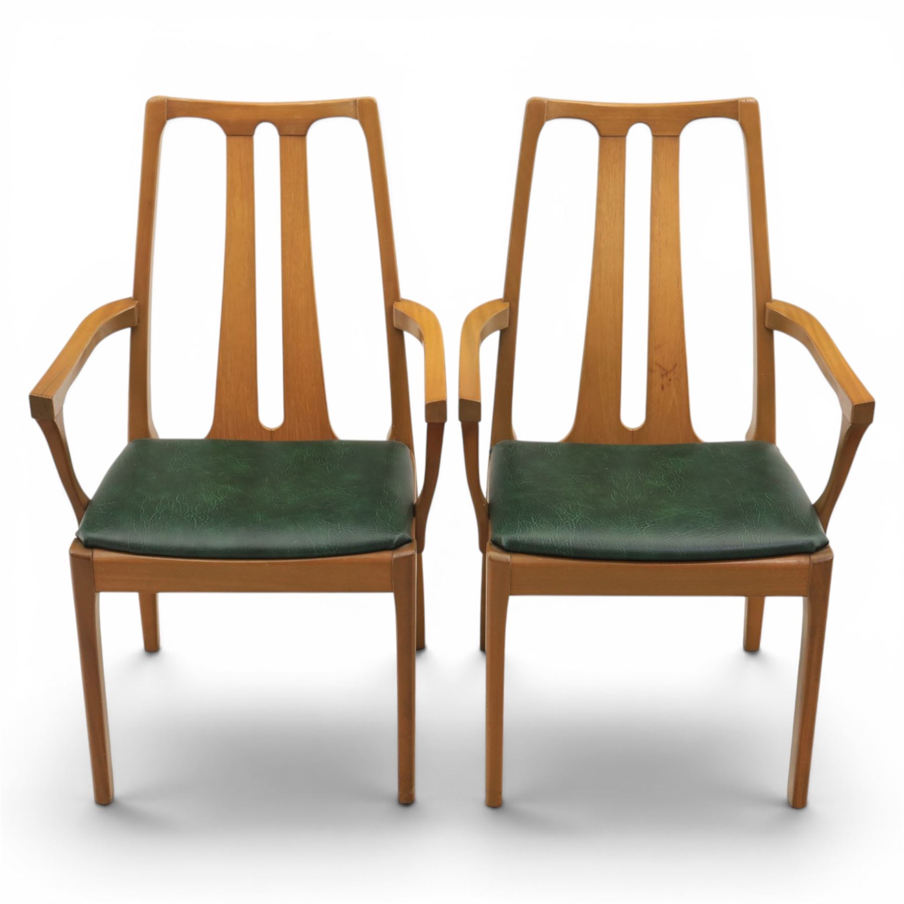 A pair of Nathan 'Highback Carvers' and a 20th century nest of teak tables, (Tables W65cm, D38cm, H49cm)
(Carvers W57, H97)