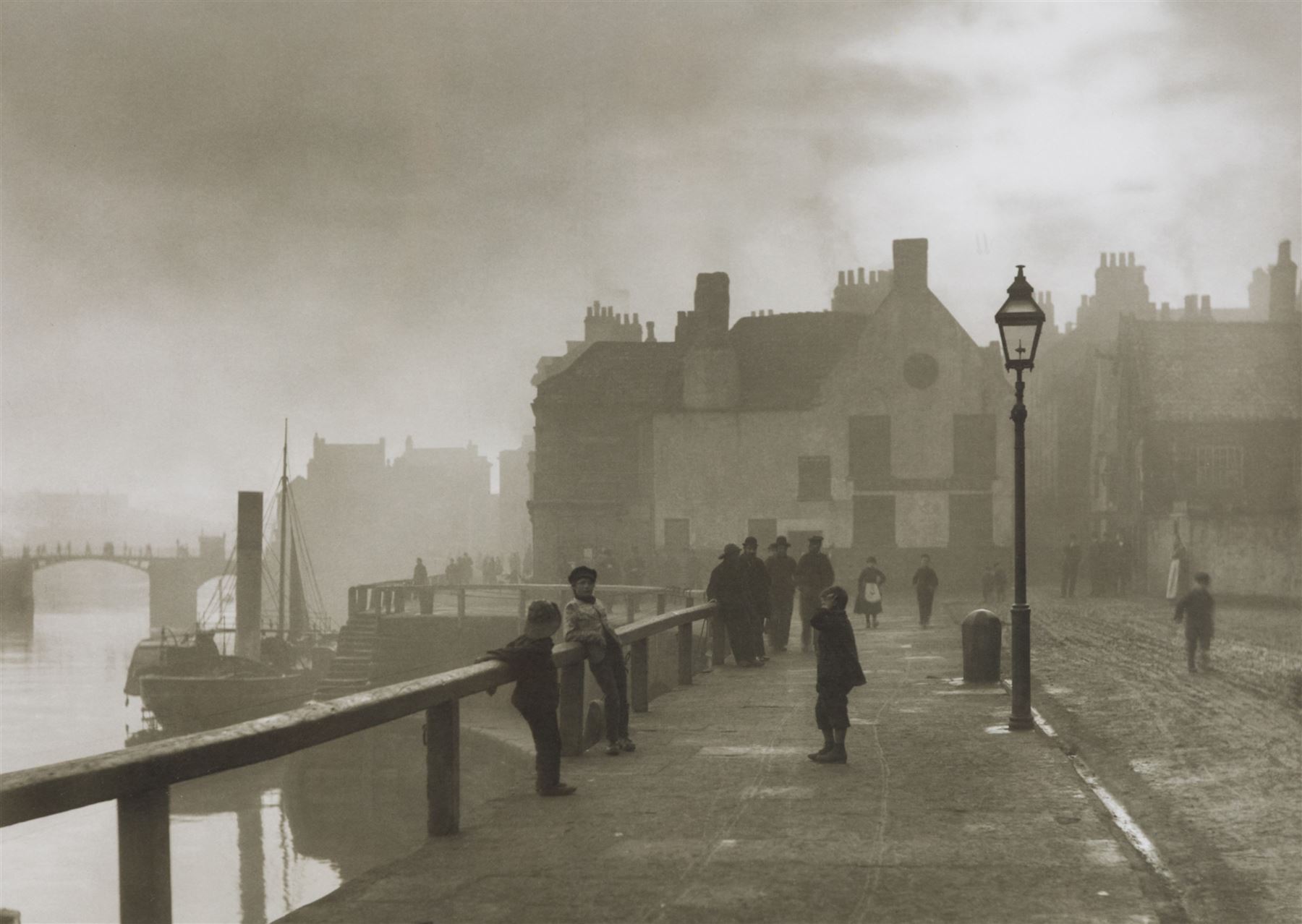 After Frank Meadow Sutcliffe (British 1853-1941): 'Pier Road Whitby', photographic print with facsimile signature 34cm x 44cm; 'Sandsend from the Railway', 19th/early 20th century photograph pub. Poulton No.A.2237, 14cm x 18cm (2) 