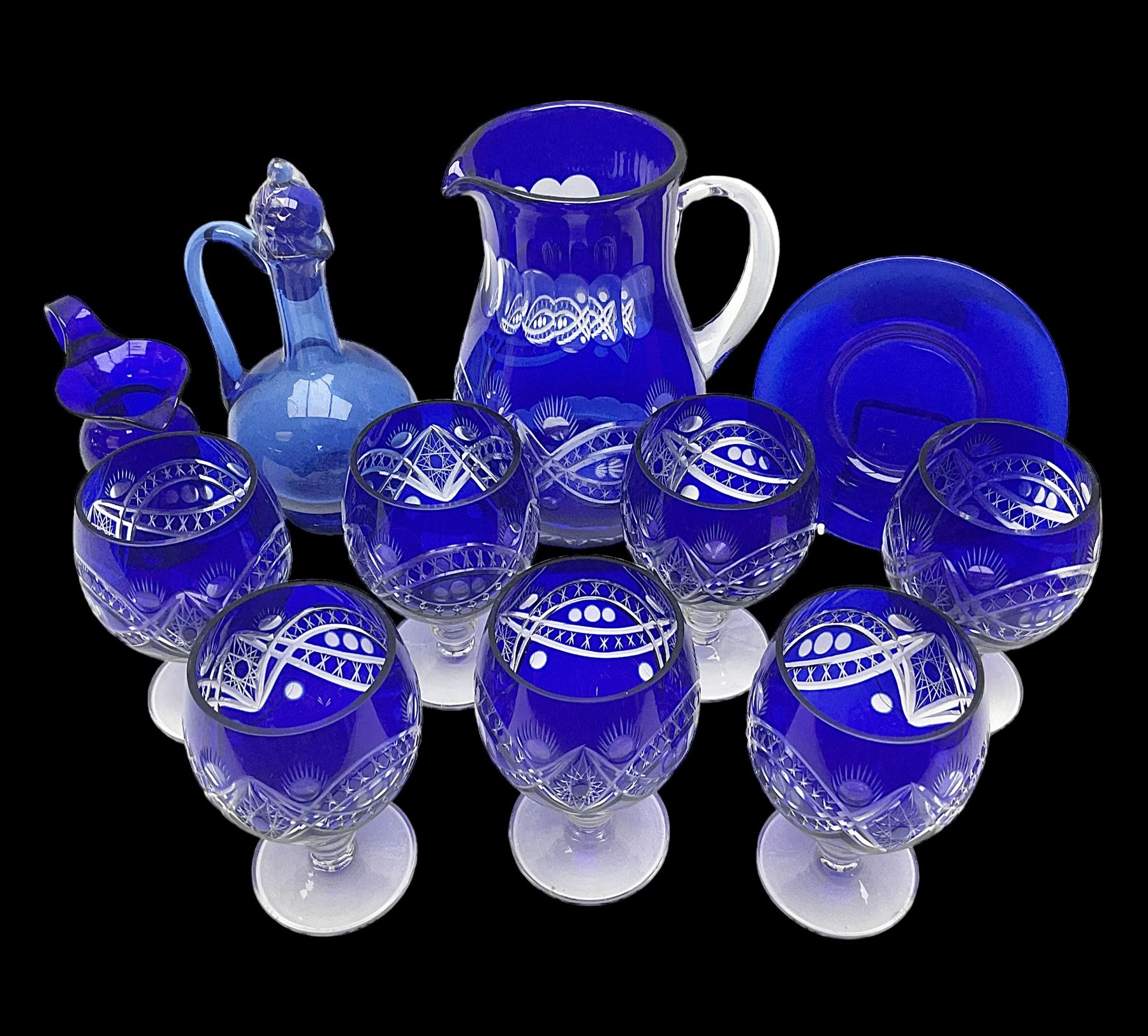 Bristol blue glass jug, together with blue claret jug, saucer, blue cut water jug, and seven matching glasses, water jug H22cm
