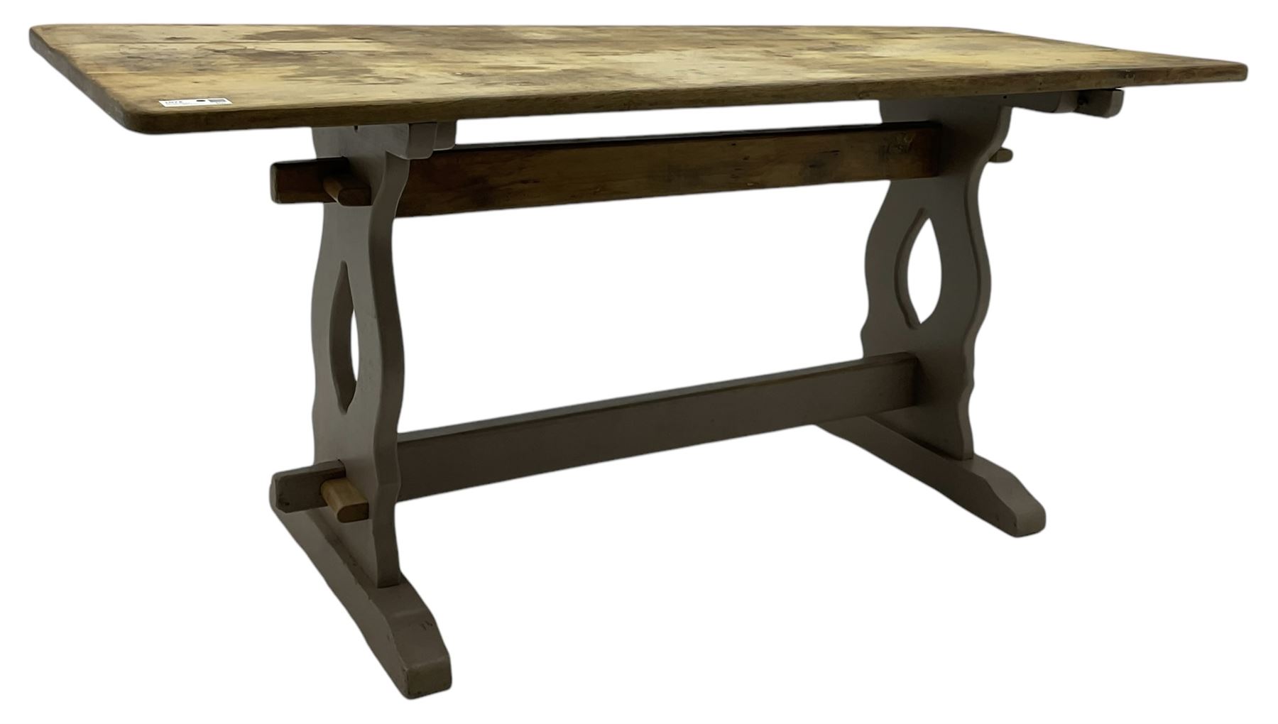 20th century oak refectory dining table, rectangular stripped top on painted base, shaped end supports on sledge feet united by two pegged stretchers